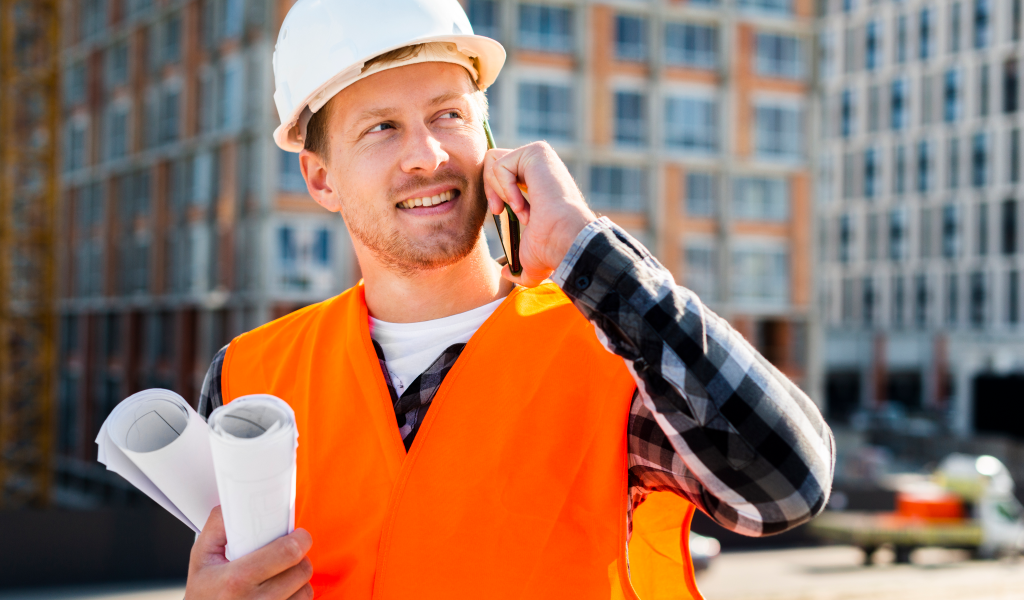 medium-shot-side-view-engineer-talking-phone