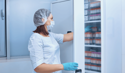nurse-takes-test-tubes-from-cabinet-1-1