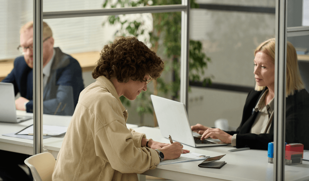 side-view-portrait-young-woman-filling-application-form-consulate-office