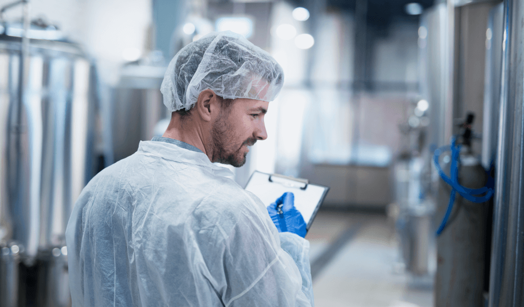 technologist-controlling-production-factory