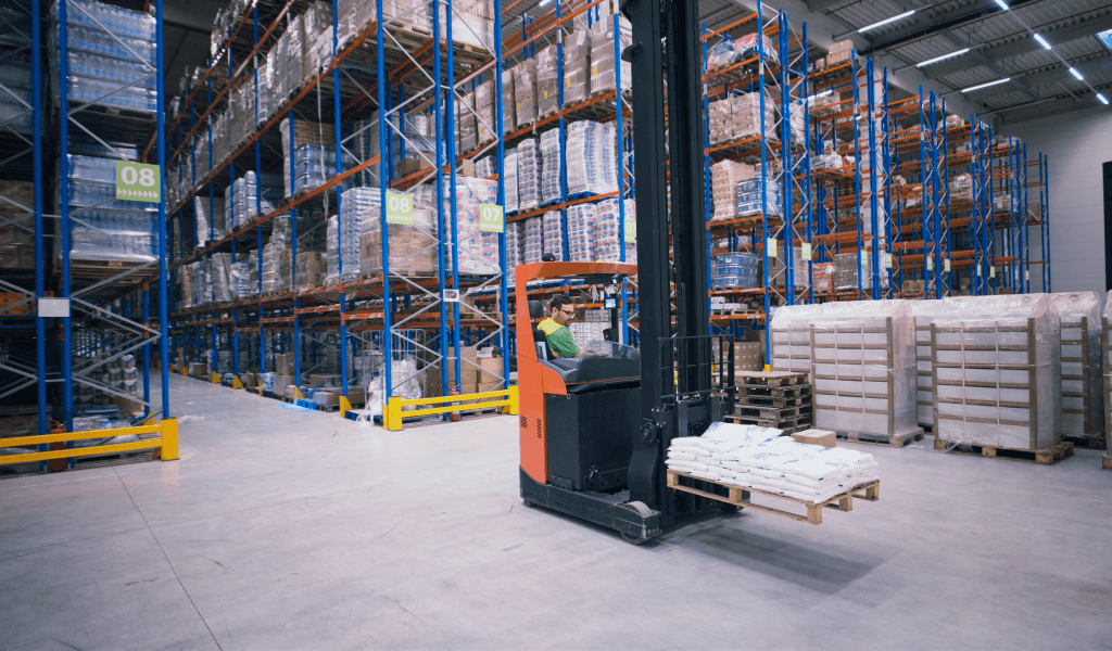 worker-operating-forklift-machine-relocating-goods-large-warehouse-center